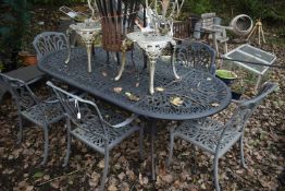 A CAST METAL OVAL GARDEN TABLE, possibly by Hartman, length 222cm x depth 107cm x height 73cm, and