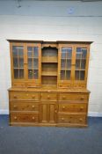 A LARGE 20TH CENTURY PINE DRESSER, the top with four glazed doors, four drawers and central