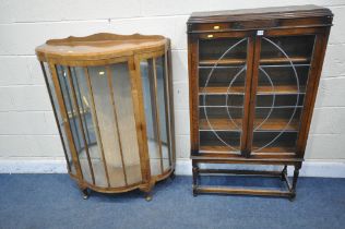 A 20TH CENTURY OAK BOOKCASE, with two lead glazed doors, on turned legs, width 76cm x depth 27cm x