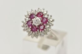 A WHITE METAL RUBY AND DIAMOND CLUSTER RING, flower cluster set with a central round brilliant cut