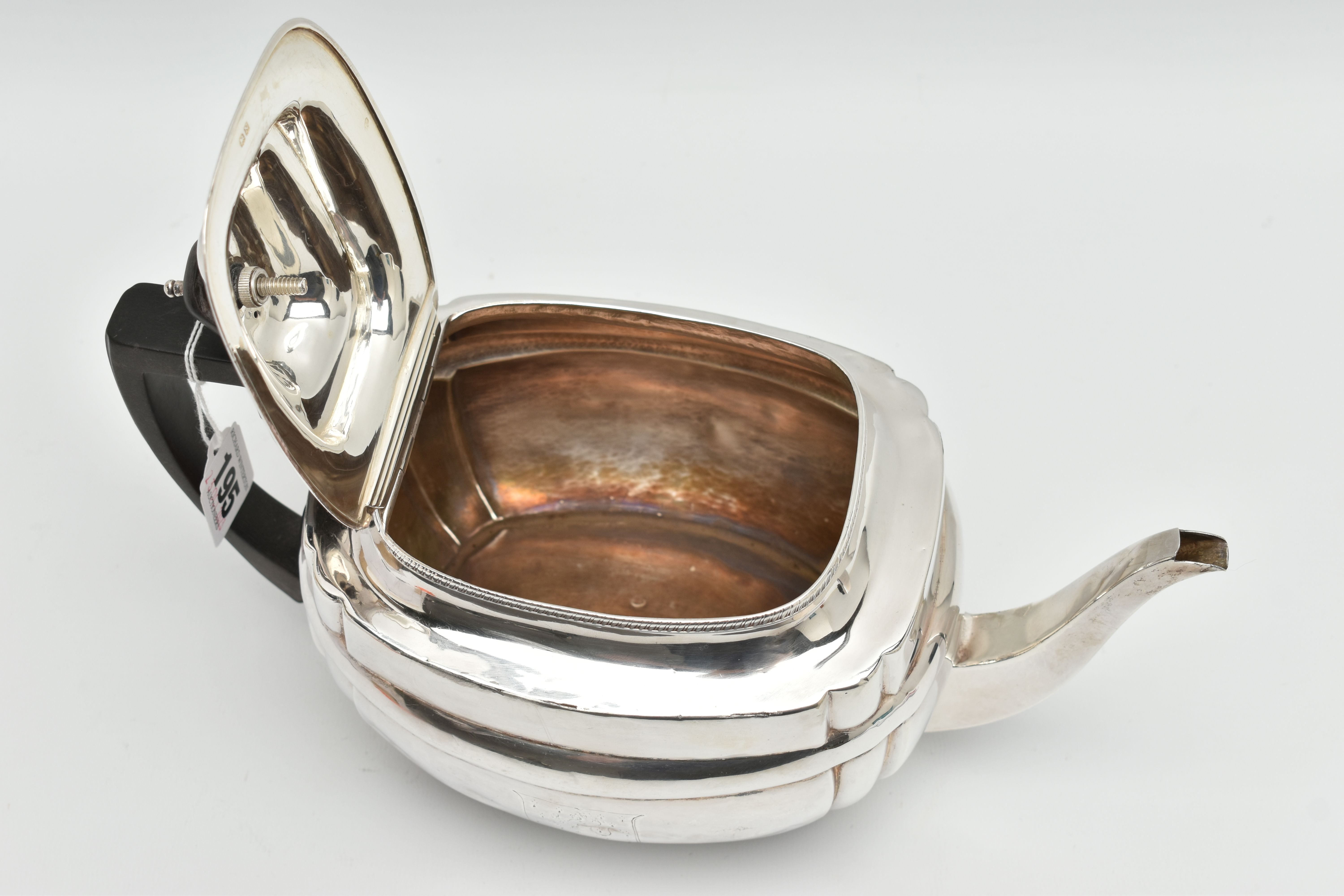 A GEORGE III SILVER TEAPOT, polished form, worn engraved crests to either side, on four ball feet, - Image 5 of 6