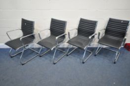 A SET OF FOUR BLACK LEATHER TUBULAR CHROME OFFICE ARMCHAIRS, in the manner of Charles and Ray