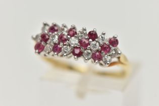 AN 18CT GOLD RUBY AND DIAMOND CLUSTER RING, designed as three rows of alternating round brilliant