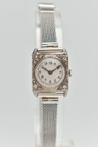 AN EARLY 20TH CENTURY COCKTAIL WATCH, the 18ct case circular face within a square shape surround set
