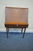 IN THE MANNER OF RICHARD HORNBY, A MID-CENTURY TEAK BUREAU/WRITING DESK, the fall front door