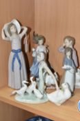 A GROUP OF LLADRO AND NAO FIGURES, comprising Lladro: Trying on a Straw Hat, model no 5011, sculptor