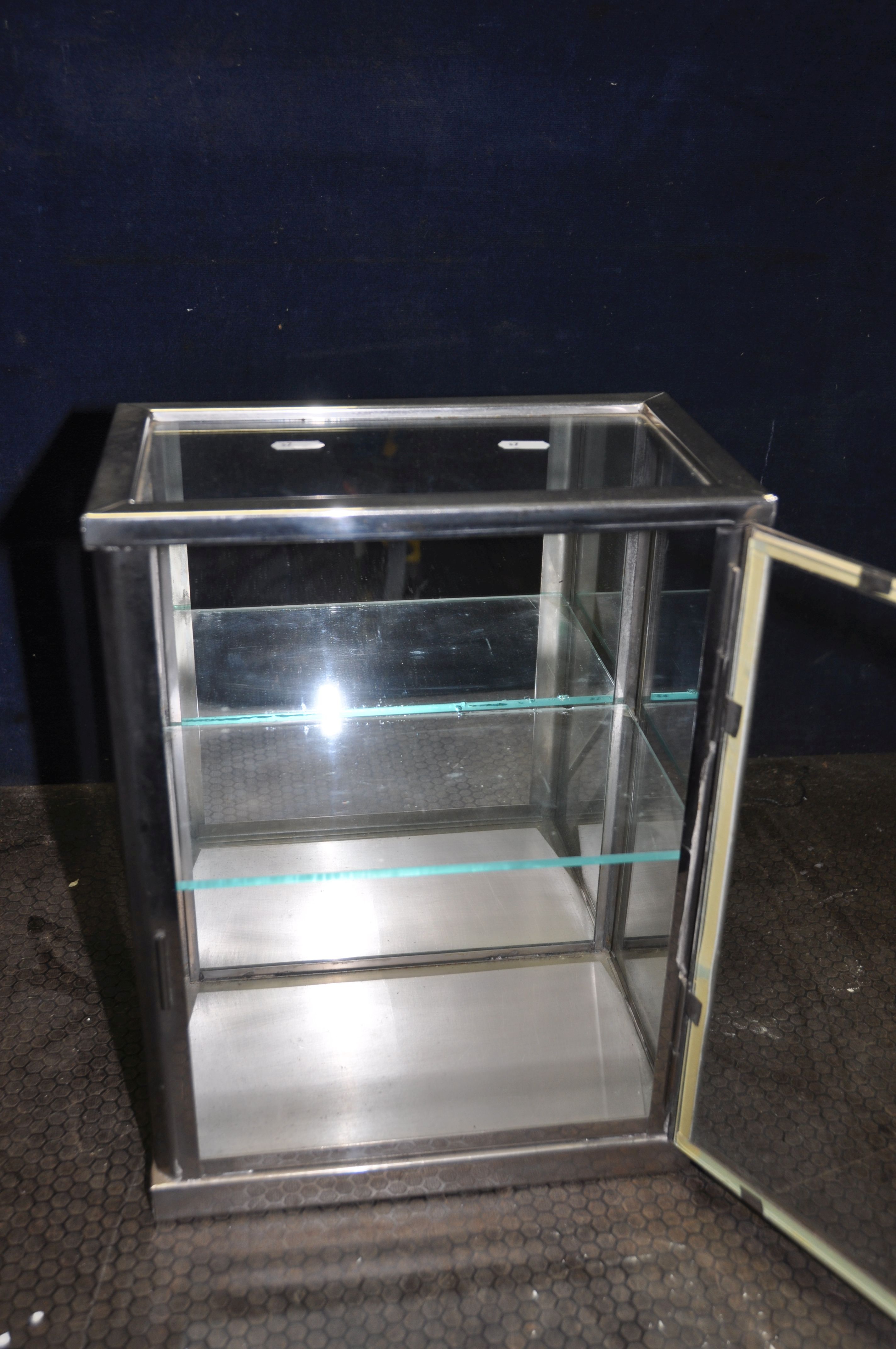 A CHROMED METAL GLASS MEDICAL/DISPLAY CABINET, with a mirrored back and single glass shelf, width - Image 2 of 2
