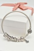A BOXED 'PANDORA' CHARM BRACELET, polished bangle fitted with a textured hinged ball clasp,