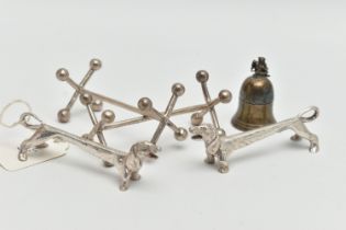 A PAIR OF ELIZABETH II SILVER NOVELTY KNIFE RESTS IN THE FORM OF DACHSHUNDS, makers Roberts & Dore