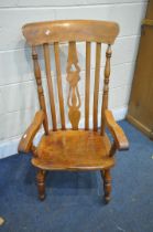 A 19TH CENTURY ELM AND BEECH FARMHOUSE WINDSOR ARMCHAIR (condition report: legs cut down, one leg