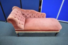A REPRODUCTION CHAISE LOUNGE, with pink upholstery (condition report: in need of a clean)