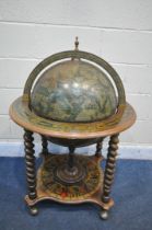 A DRINKS GLOBE, with a hinged lid, enclosing a fitted interior, on barley twist supports, united