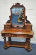 A VICTORIAN MAHOGANY DUCHESS DRESSING TABLE, with a single swing mirror, six assorted drawers, on