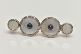 A CONVERSION BROOCH, four mother of pearl white and yellow metal dress studs fitted together, fitted