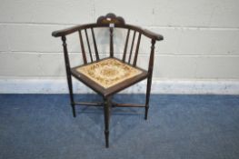 AN EDWARDIAN MAHOGANY AND INLAID BOW TOP CORNER CHAIR, with turned supports, legs and stretchers,