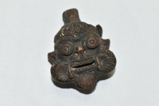 A TERRACOTTA AMULET OF THE MESOPOTAMIAN GOD PAZUZU, height 7.5cm (Condition Report: chipped nose,