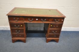 A REPRODUCTION MAHOGANY TWIN PEDESTAL DESK, with green tooled leather writing surface and an