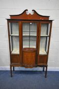 AN EDWARDIAN MAHOGANY AND INLAID DISPLAY CABINET, with swan neck pediment two glazed doors, a