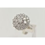 A WHITE METAL DIAMOND CLUSTER DRESS RING, circular cluster of round brilliant cut diamonds, centre