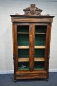 A 20TH CENTURY FRENCH WALNUT TWO DOOR CUPBOARD, with fluted pillars, the doors enclosing three