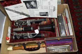 A BOX OF MUSICAL INSTRUMENTS, comprising a Boosey & Hawkes Emperor clarinet in fitted case, Hohner
