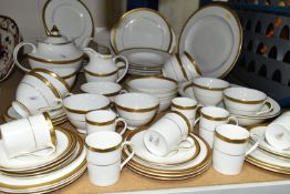 ROYAL DOULTON 'ROYAL GOLD' DESIGN DINNERWARE, comprising nine cups (one chipped foot), seven saucers