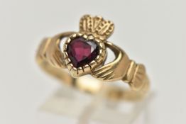A 9CT GOLD GARNET CLADDAGH RING, the heart shape garnet to the Claddagh design ring, with 9ct