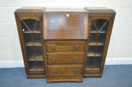 A 20TH CENTURY OAK SIDE BY SIDE BUREAU BOOKCASE, with two glazed doors, flanking a fall front