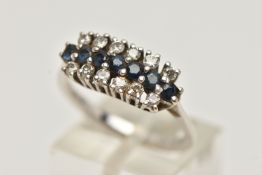 AN 18CT WHITE GOLD DIAMOND AND SAPPHIRE RING, designed with a central row of circular cut blue