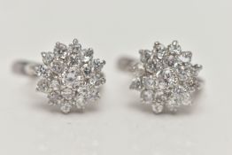 A PAIR OF WHITE METAL CUBIC ZIRCONIA EARRINGS, cluster setting, fitted with posts and lever back