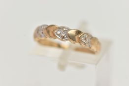 A 9CT GOLD DIAMOND DRESS RING, the front half ring set with heart shape panels alternatively set