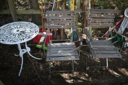 A PAIR OF IRON AND TEAK FOLDING ARMCHAIRS, along with a painted aluminium garden table (3)