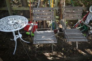 A PAIR OF IRON AND TEAK FOLDING ARMCHAIRS, along with a painted aluminium garden table (3)
