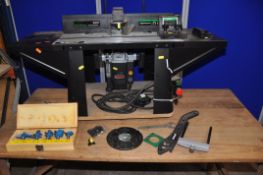 A TREND ROUTER TABLE with fence (one coach bolt missing), vertical support, a Freud FT2000VCE V2 1/
