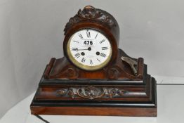 A VICTORIAN ROSEWOOD AND EBONISED CASED MANTEL CLOCK, the drum shaped clock case with foliate