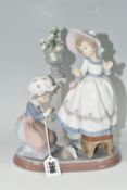 A LLADRO FIGURE GROUP 'A STITCH IN TIME', model no 5344, sculpted by Regino Torrijos, issued 1986-