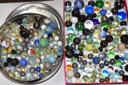 A TIN OF MARBLES, assorted styles, types colours and sizes, condition ranges from good to poor (1