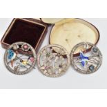 THREE OPEN WORK BROOCHES, the first a circular form brooch with floral detail, an enamel detailed