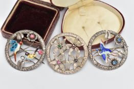 THREE OPEN WORK BROOCHES, the first a circular form brooch with floral detail, an enamel detailed