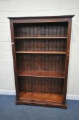 A STAINED PINE OPEN BOOKCASE, five shelves, width 127cm x depth 38cm x height 201cm (condition