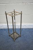 A BRASS AND CAST IRON STICK STAND, with four divisions, 20cm squared x height 54cm (condition