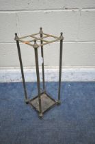A BRASS AND CAST IRON STICK STAND, with four divisions, 20cm squared x height 54cm (condition