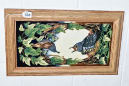 A FRAMED MOORCROFT POTTERY WALL PLAQUE, impressed and painted marks on reverse c2003, depicting a