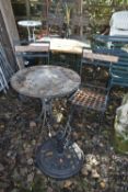 AN IRON AND TILE CIRCULAR FOLDING GARDEN TABLE, a pair of folding chairs, and a parasol stand (