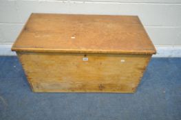 A 19TH CENTURY PINE BLANKET CHEST, with a hinged lid and twin handles,