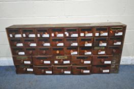 AN APOTHECARY CABINET, fitted with an arrangement of thirty-four drawers, five drawers with glass