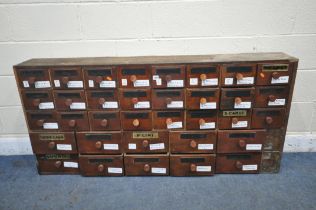 AN APOTHECARY CABINET, fitted with an arrangement of thirty-four drawers, five drawers with glass