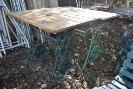 TWO VINTAGE TREADLE SEWING MACHINE BASES, one with a marble top, the other with a wooden top (2)