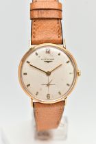 A LONGINES WRISTWATCH, the circular face with cream coloured dial, baton and Arabic markers,