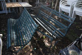 A PAINTED STRAPWORK IRON AND TEAK SCROLLED BENCH, length 145cm, along with another strapwork